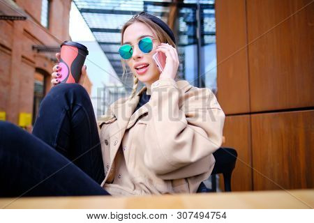 woman using smartphone in caffee shop. smart phone or mobile 