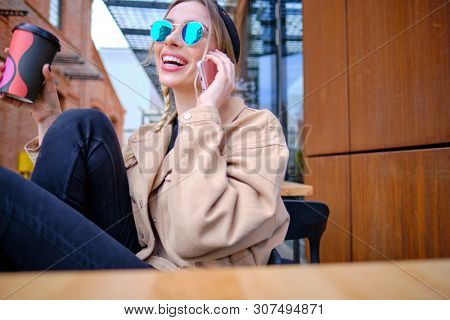 woman using smartphone in caffee shop. smart phone or mobile 