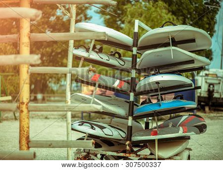 Outdoor Mobile Stand With Surf Surfboards And Windsurfing For Beginners In School