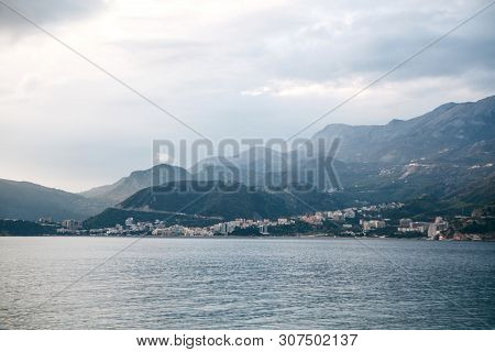 Beautiful Views Of The Mountains, The Sea And The City Of Budva In Montenegro. The City Is Among The