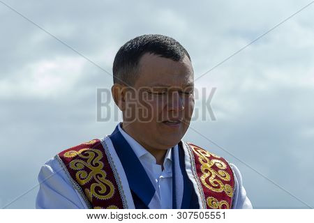 Mullah Man In Muslim Clothes Praying, Front View, Surgut, Russia - June 16, 2019