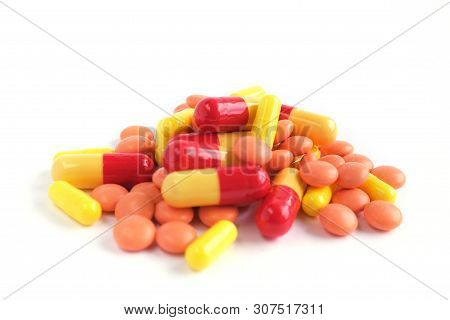 Multicolor Tablets On White Background. Epidemic, Painkillers, Healthcare, Treatment Pills And Drug 