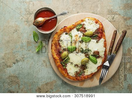 Pizza Margherita Served With Mozzarella Cheese, Tomato Sauce And Fresh Basil