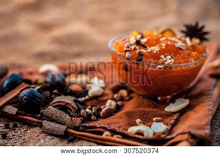 Famous Mango Preservation I.e. Murba Or Murabba In A Glass Bowl On Jute Bag's Surface Along With Dry