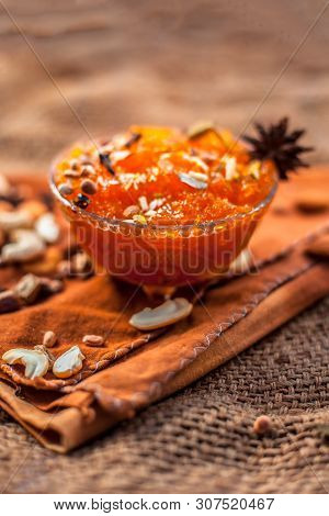 Famous Mango Preservation I.e. Murba Or Murabba In A Glass Bowl On Jute Bag's Surface Along With Dry