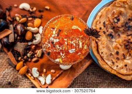 Famous Mango Preservation I.e. Murba Or Murabba In A Glass Bowl On Jute Bag's Surface Along With Dry