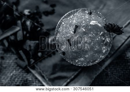 Famous Indian Dessert And Sweet Dish In A Glass Bowl On Jute Bag's Surface I.e. Murabba Or Murba Alo