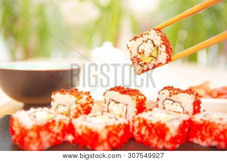 Maki Roll With Salmon, Popular Japanese Cuisine. Sushi Roll With Fish, Cream Cheese And Vegetables H
