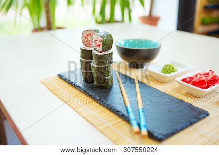 Maki Roll With Salmon, Popular Japanese Cuisine. Sushi Roll With Fish, Cream Cheese And Vegetables H