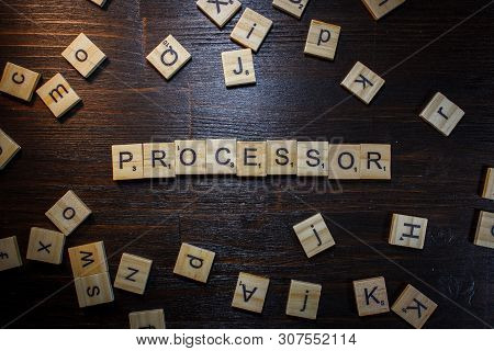 Word Or Phrase Processor Made With Scrabble Letters On Black Table.