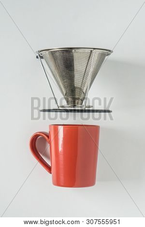 Red Coffee Mug On White Background With Filterless Metal Pour Over Drip Cone