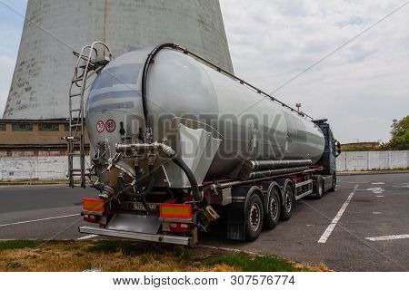 A Tank Druck Standing In Front Of A Refinery