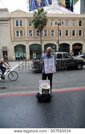 6/18/2019 Hollywood, California: Street Scenes of Hollywood California with street vendors, street performers, homeless, tourist, landmarks and various buildings with signs. Editorial Use Only. 