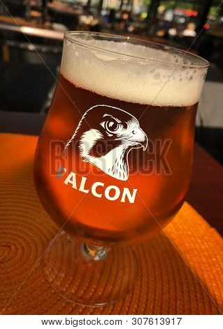 Karlstad, Sweden - June 19, 2019: A Glass Of The Falcon Brand Beer.