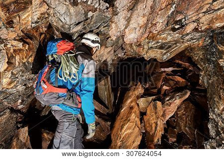 Young Speleologist Is Exploring A Dark Cave