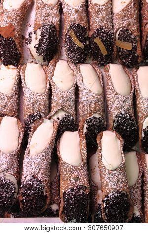 Pile Of Sicilian Cannoli Filled With Ricotta And Chocolate Chips