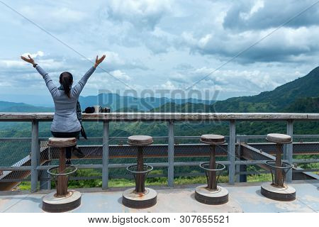 Smiling Asian Woman Drinking Coffee And Tea And Take A Photo And Relax In Sun Sitting Outdoor In Sun