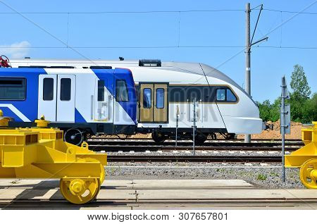 Modern Subway Rolling Stock And European High-speed Passenger Train On An Open  Railway Area Of The 