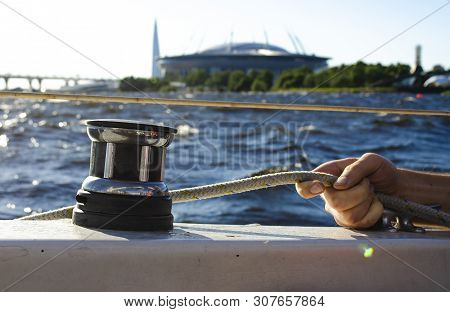 Handsome Man Working On Sailboat, Pulling Rope, Active Summer Vacation On Water Transport, Having Fu