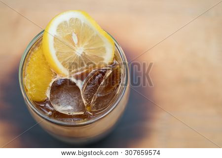 Glass Of Espresso Shot Mixed With Orange Juice And Topped With Fresh Sliced Orange