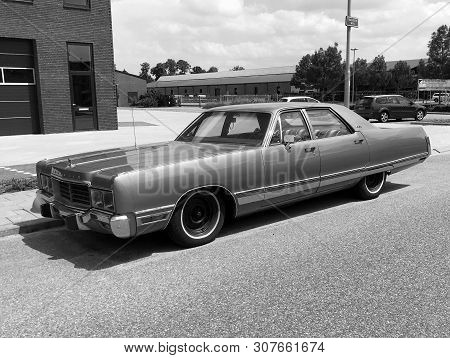 Woerden, The Netherlands - June 22, 2019: Chrysler New Yorker Parked By The Side Of The Road. Nobody