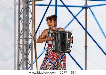 Performance Of Artists With A Vocal Number To The Accompaniment Of The Accordion At The Celebration