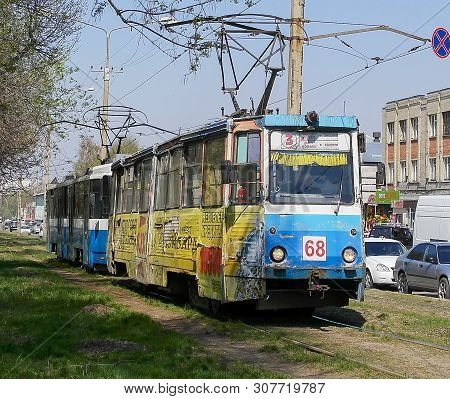 Kazakhstan, Ust-kamenogorsk, May 6, 2019: Old Soviet Tram Ktm 5 (71-605). Old Tram Tows New. Old And