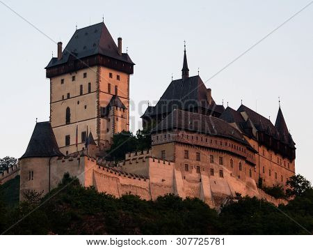 Gothic Karlstejn Castle At Sunset In Bohemia Czech Republic, A Medieval Fortress Buildt By Charles I