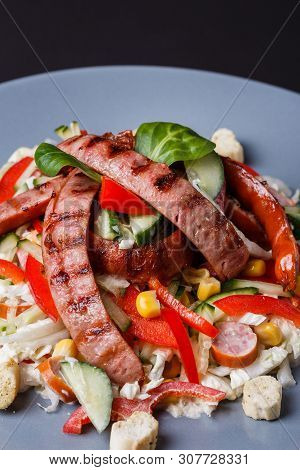 Salad With Grilled Sausage Paprica Cucumber And Croutons