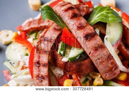 Salad With Grilled Sausage Paprica Cucumber And Croutons