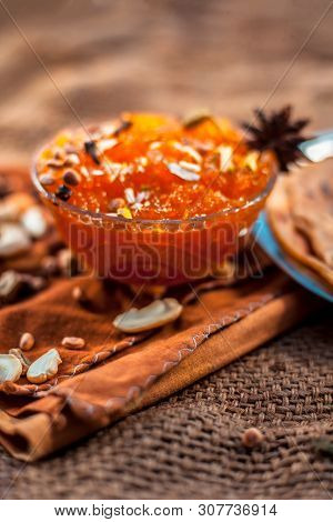 Famous Mango Preservation I.e. Murba Or Murabba In A Glass Bowl On Jute Bags Surface Along With Dry