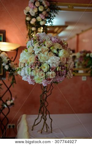 Bouquet Of Flowers On A Leg In The Interior Of The Restaurant For A Celebration Shop Floristry Or We