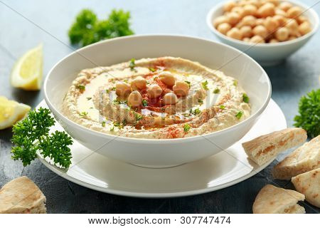 Hummus With Olive Oil, Paprika, Lemon And Pita Bread
