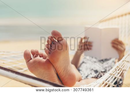 Woman Reading A Book On Hammock Beach In Free Time Summer Holiday