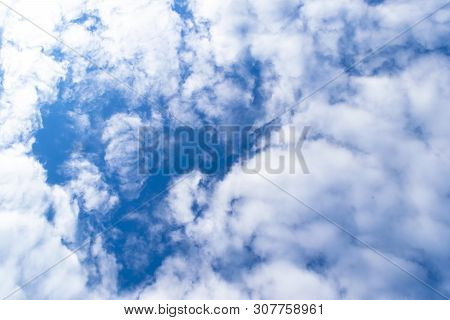 Nature Background. White Clouds Over Blue Sky. Blue Sky With Clouds And Sun.