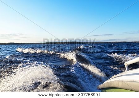 Side View Speeding Fishing Motor Boat With Drops Of Water. Blue Ocean Sea Water Wave Reflections Wit