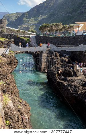 Porto Moniz, Madeira, Portugal - April 18, 2018: Natural Rock Pool Of Porto Moniz On Madeira Island.