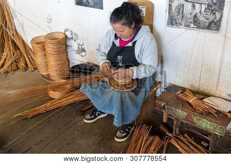 Camacha, Madeira, Portugal - April 19, 2018: A Basket Weaver At Work In The Factory Shop In Camacha 