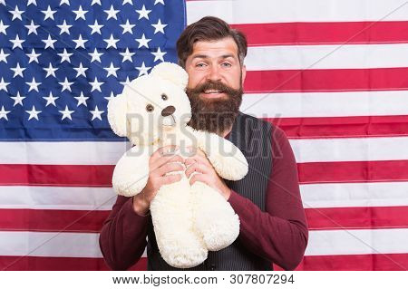 The Enthusiastic Spirit. Patriotic Man Holding Teddy Bear On Independence Day. Bearded Hipster Being