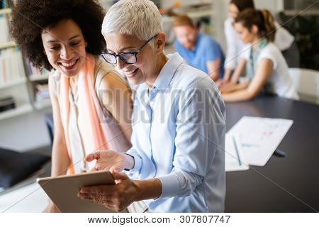 Successful Group Of Business People At Work In Office