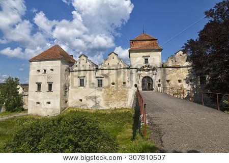 Ancient Historical Fortified Svirz ( Svirzh ) Castle At A Summer Day Against The Blue Sky And White 