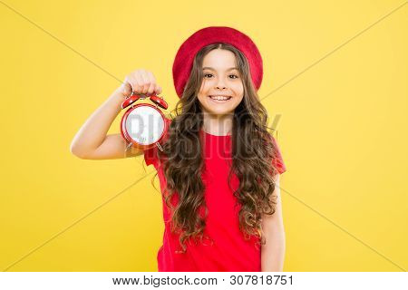 Little Girl In French Style Hat. Beauty Hairdresser And Fashion. Child With Alarm Clock. Timeless Fa