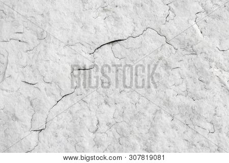 The Texture Of Natural White Granite Stone With Cracks. Background Of Natural Stone Gray. Texture Wi