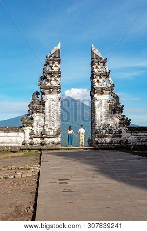 Unidentified Couple At Gate At Pura Lempuyang Luhur With Mr Agung Volcanic View, Sacred Hinduism Tem