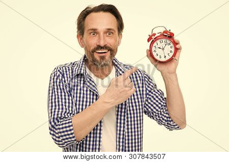 Please Observe Time. Mature Man Pointing Finger At Alarm Clock. Mature Timekeeper With Analog Clock.