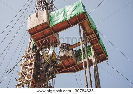 Drilling Rig In Oil Field For Drilled Into Subsurface In Order To Produced Crude. Petroleum Industry