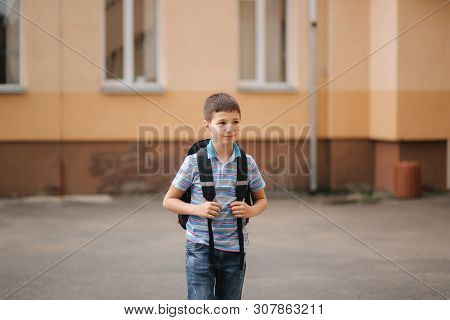 Cute Little Boy With Backpack Go Home After Scholl Class