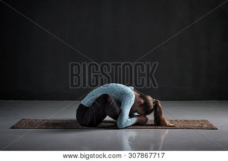 Woman Doing Yoga Or Pilates Butterfly Exercise, Sitting In Baddha Konasana