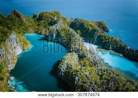 Aerial Drone View Of Big Lagoon Surrounded By Jagged Limestone Karst Cliffs In Morning Soft Light Ju