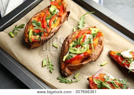 Baking Sheet With Stuffed Sweet Potatoes On Table, Closeup